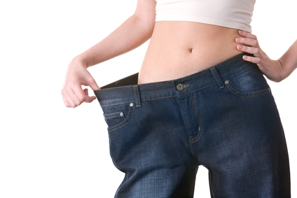 Close-up of female figure with jeans of big size on